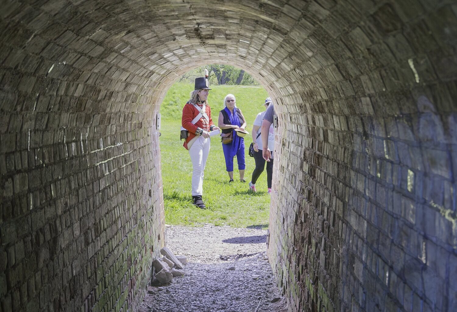 Gavin Watson, a historical re-enactor, shows visitors the entrance to the Sally Port, a a controlled, arched tunnel entry through the fort's star-shaped earthworks.