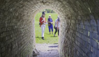 Gavin Watson, a historical re-enactor, shows visitors the entrance to the Sally Port, a a controlled, arched tunnel entry through the fort's star-shaped earthworks.