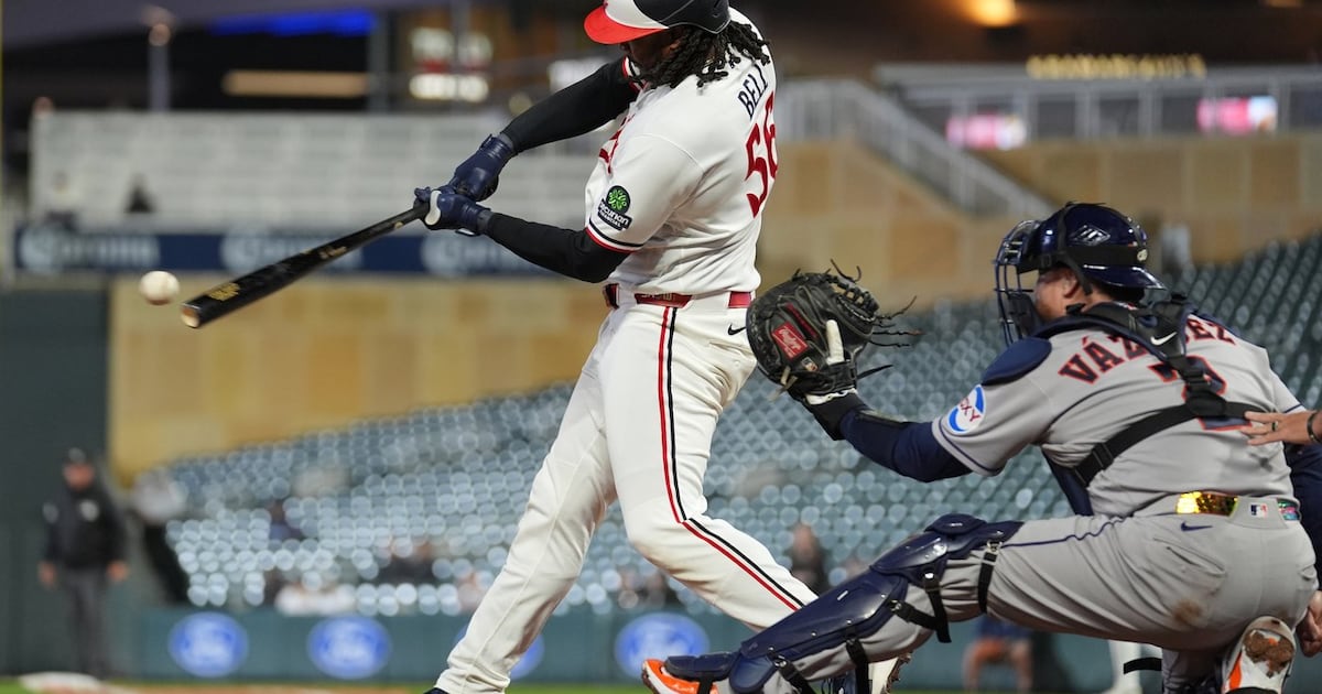 Josh Bell homers twice as Twins beat Astros in game delayed nearly two hours by rain