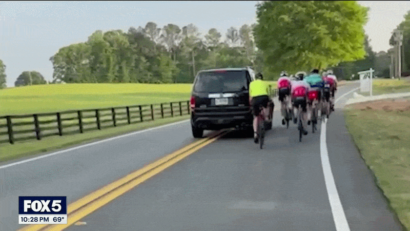 GIF of SUV hitting cyclist