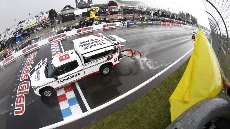 NASCAR track drying vehicles work on the wet frontstretch at Watkins Glen International before the Go Bowling at The Glen race weekend.