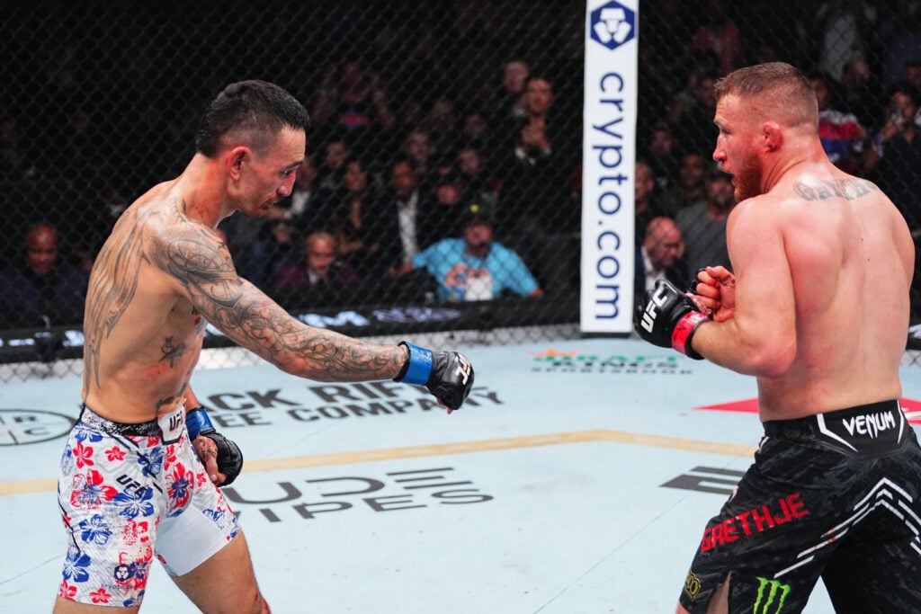 Max Holloway points down to Justin Gaethje