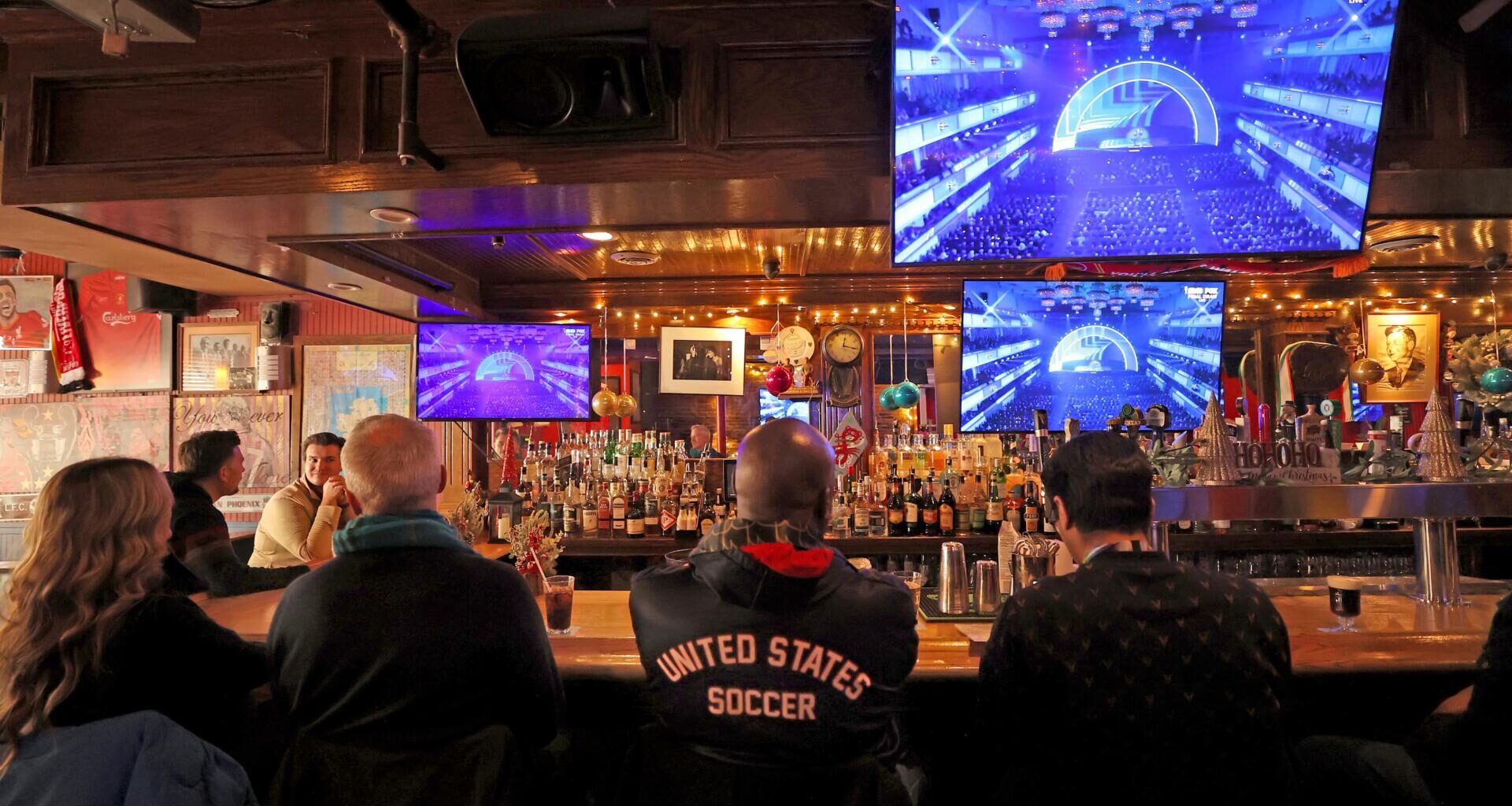 Patrons at Phoenix Landing in Cambridge watch the FIFA World Cup 2026 draw on Dec. 5, 2025.