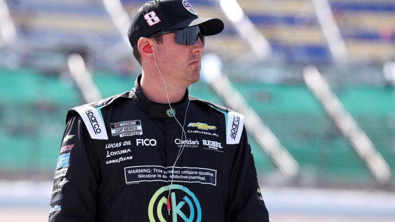 Kyle Busch looks on before NASCAR Cup Series qualifying at Kansas Speedway