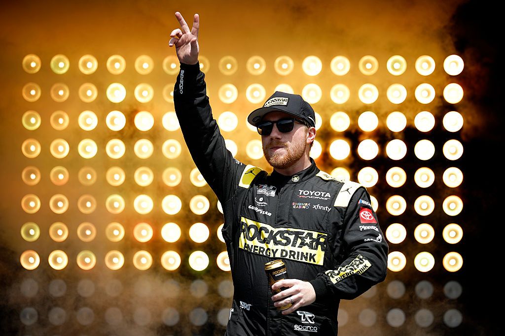 TALLADEGA, ALABAMA - APRIL 26: Tyler Reddick, driver of the #45 Rockstar Energy Drink Toyota, waves to fans as he walks onstage during driver intros prior to the NASCAR Cup Series Jack Link's 500 at Talladega Superspeedway on April 26, 2026 in Talladega, Alabama.
