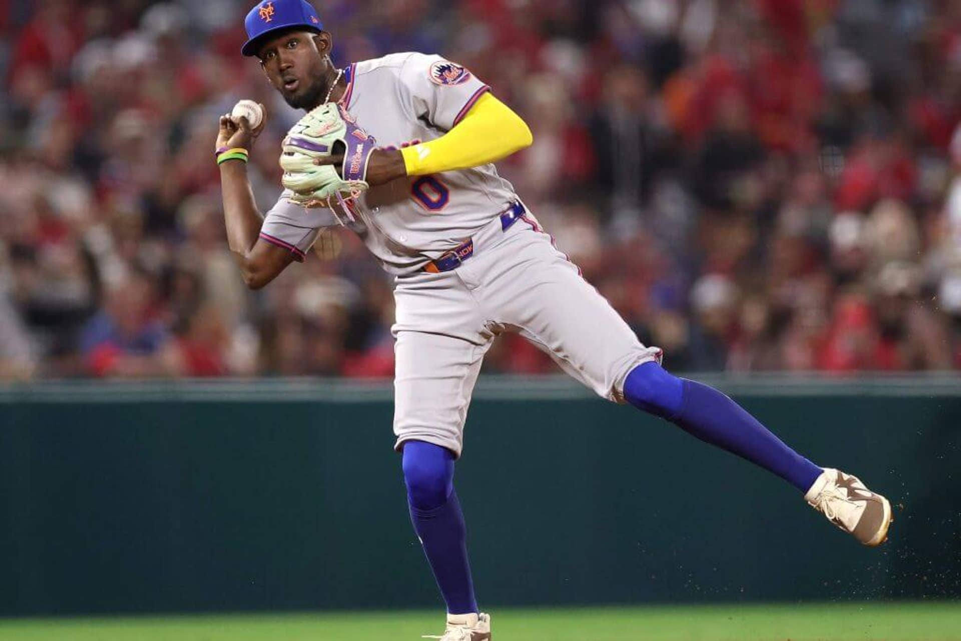 Ronny Mauricio of the New York Mets throws to first base.