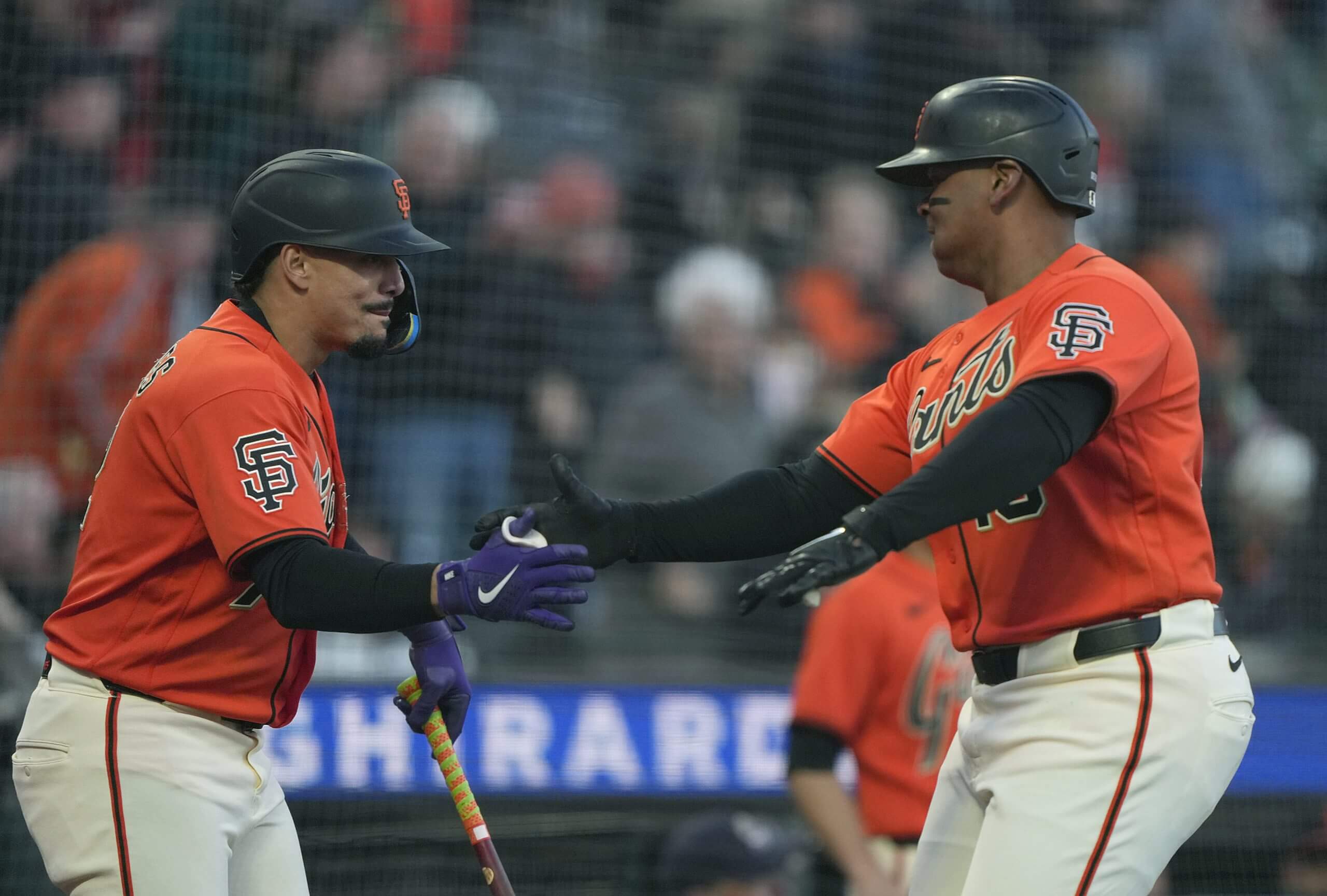 Willy Adames and Rafael Devers celebrate after Devers hit a solo home run against the Pittsburgh Pirates.