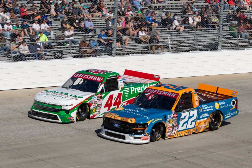 Natalie Decker (#22 Team Reaume Nico's Bagels & Brunch Ford) races with Andres Perez De Lara (#44 Niece Motorsports Precision de Mexico Chevrolet) through turn 1 during the NASCAR CRAFTSMAN Truck Series ECOSAVE 200 on May 15, 2026, at Dover Motor Speedway in Dover, DE. 
