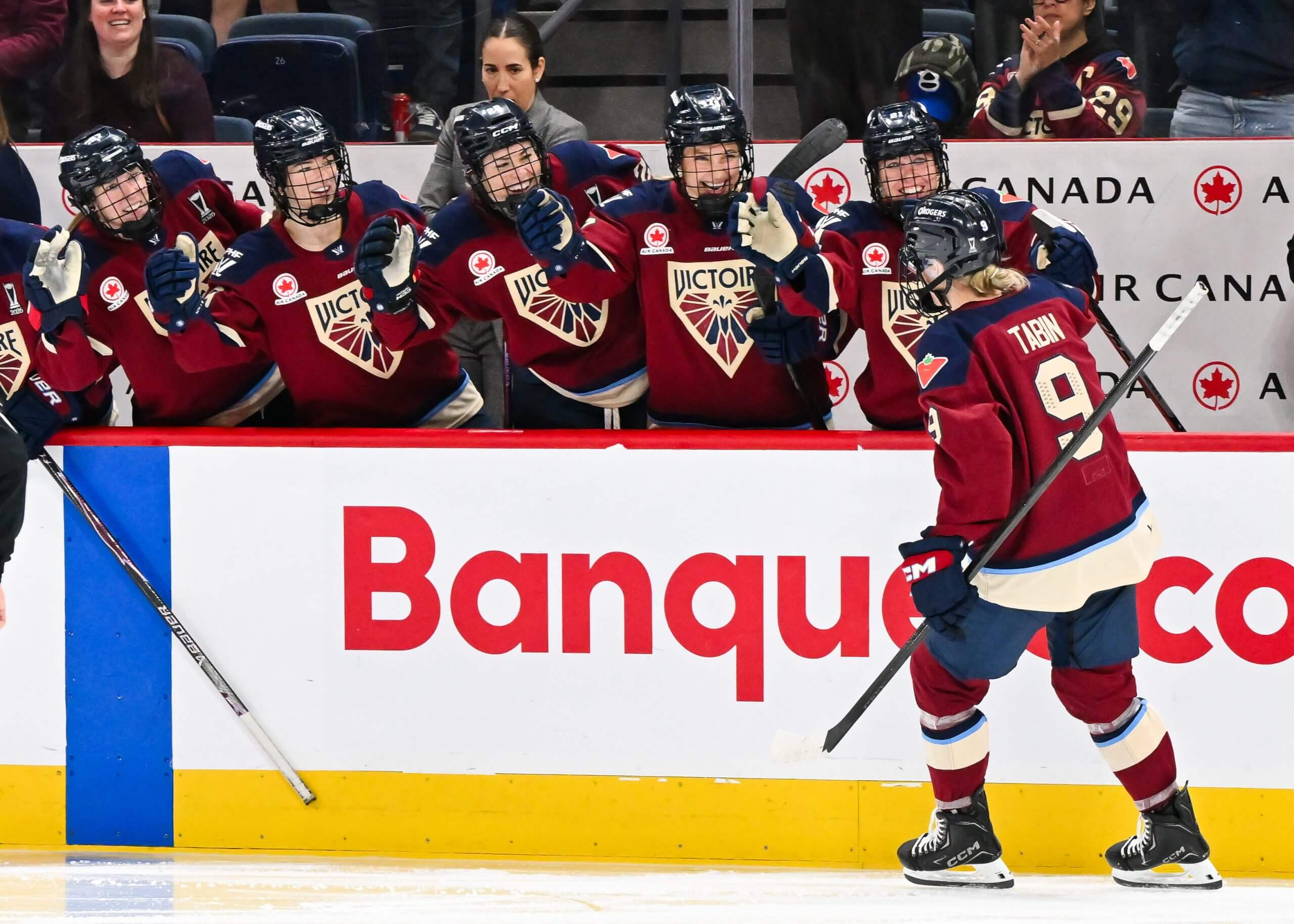 Kati Tabin skates in front of the Montreal bench.