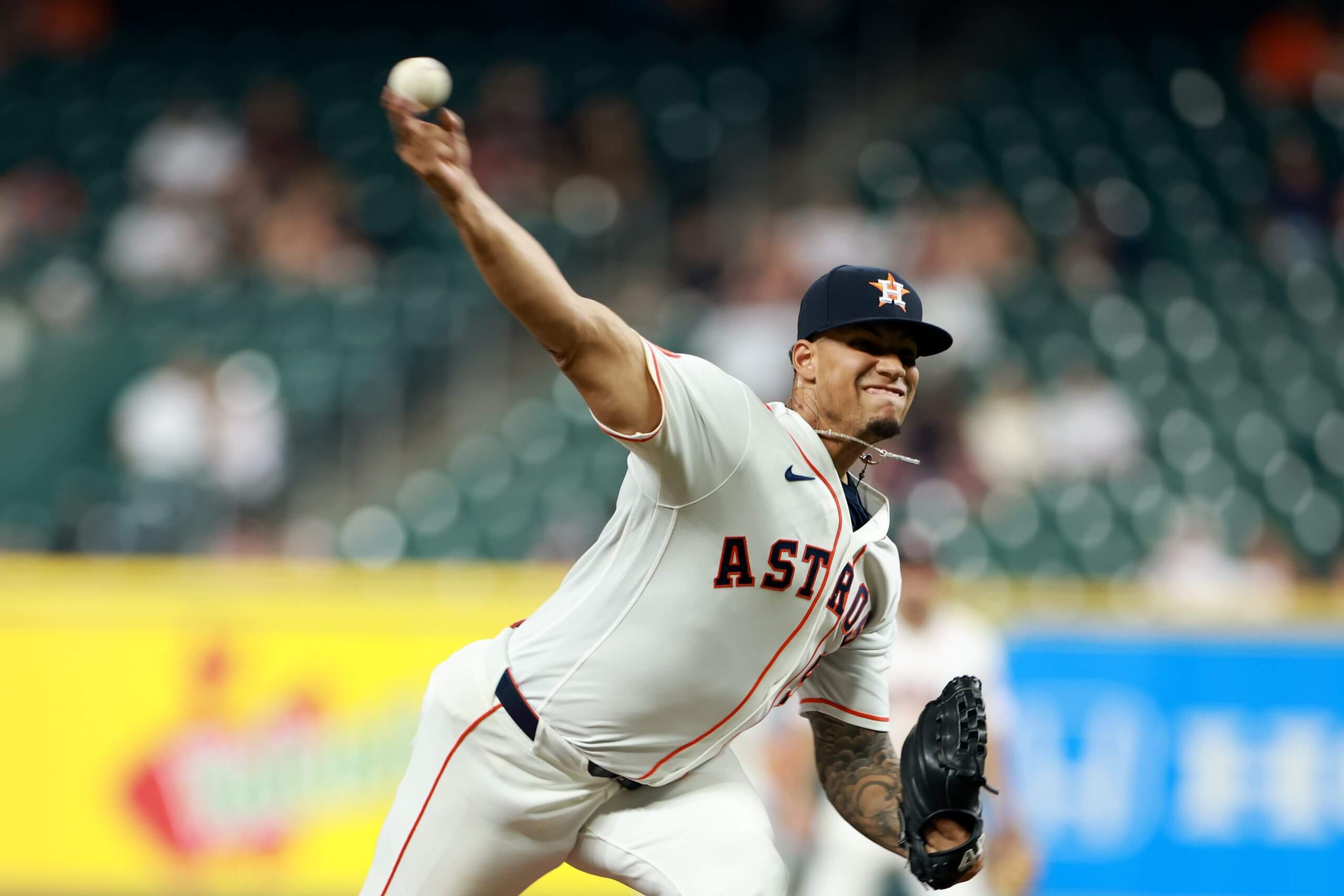 Bryan Abreu throws a pitch at Daikin Park.