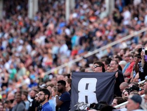 A NASCAR fan displays a #8 flag during the remembrance ceremony for Kyle Busch, who passed away suddenly at the age of 41, from the grandstands prior to the NASCAR Cup Series Coca-Cola 600 at Charlotte Motor Speedway on May 24, 2026 in Concord, North Carolina.