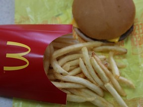 A McDonald's cheeseburger and fries.