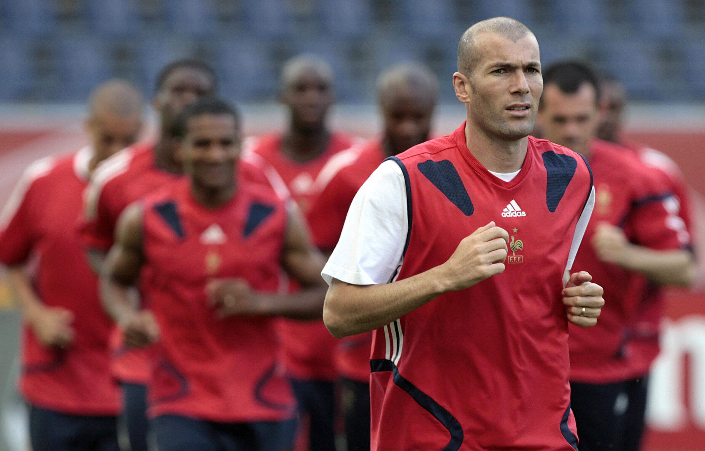 Zinedine Zidane leads his France team-mates on a pre-training jog