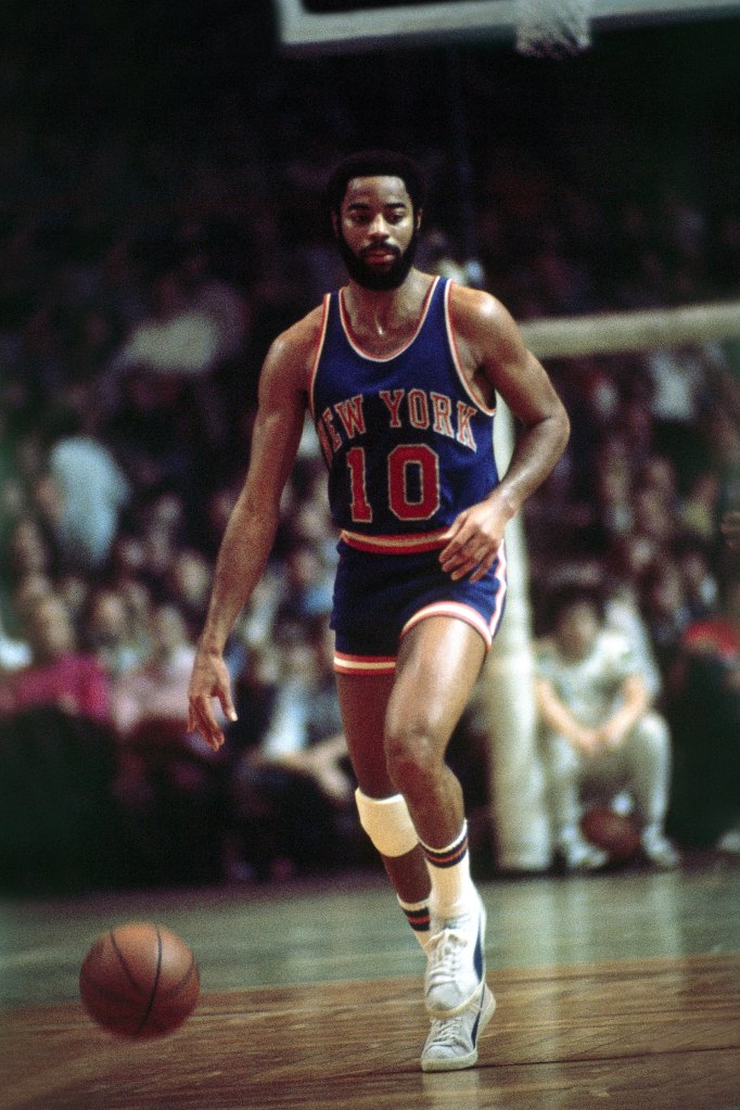 Walt Frazier brings the ball up the court