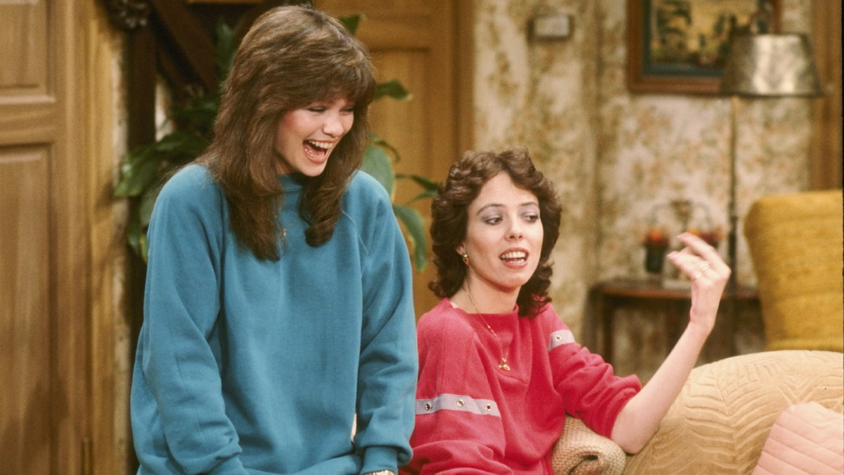 Valerie Bertinelli and Mackenzie Phillips standing together on set