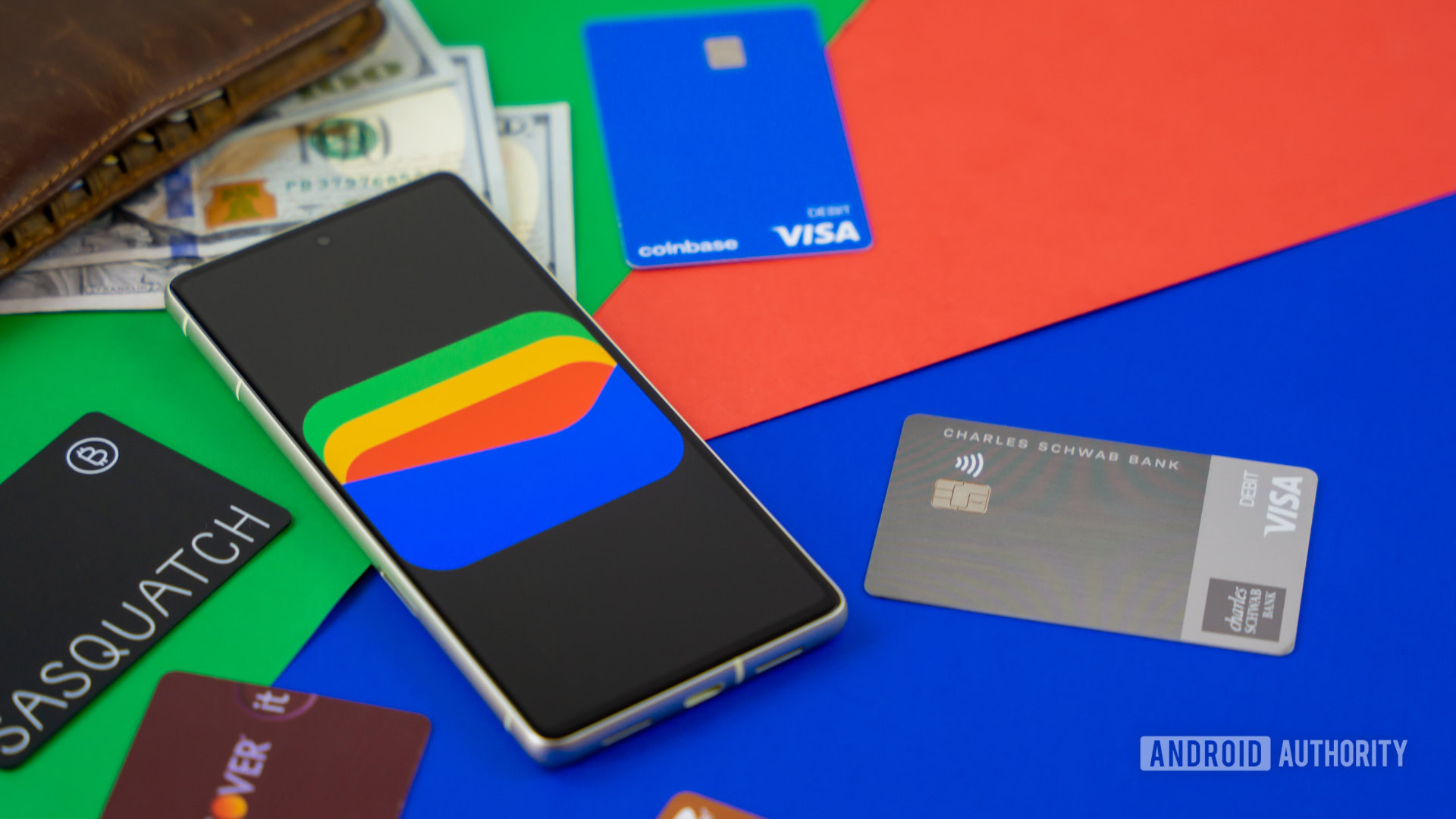 Google Wallet logo on smartphone next to credit cards and cash Stock photo 1 Google Wallet logo on smartphone next to credit cards and cash Stock photo 1