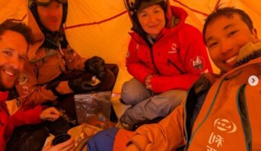 The international four-person team comprising Gilles Denis, Sasha Doyle, Ed Luke, and Wilson Cheung in a tent on the the Greenland Ice Sheet,