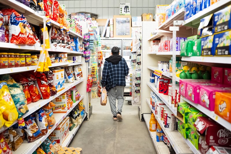 A person shops at a grocery store in Neskantaga, Ont., on Oct. 26, 2025. (Christopher Katsarov / The Canadian Press)