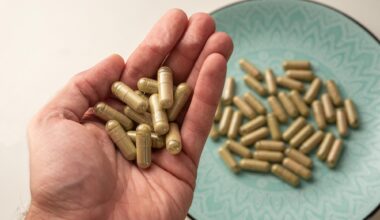 Hand Holding Kratom Pills