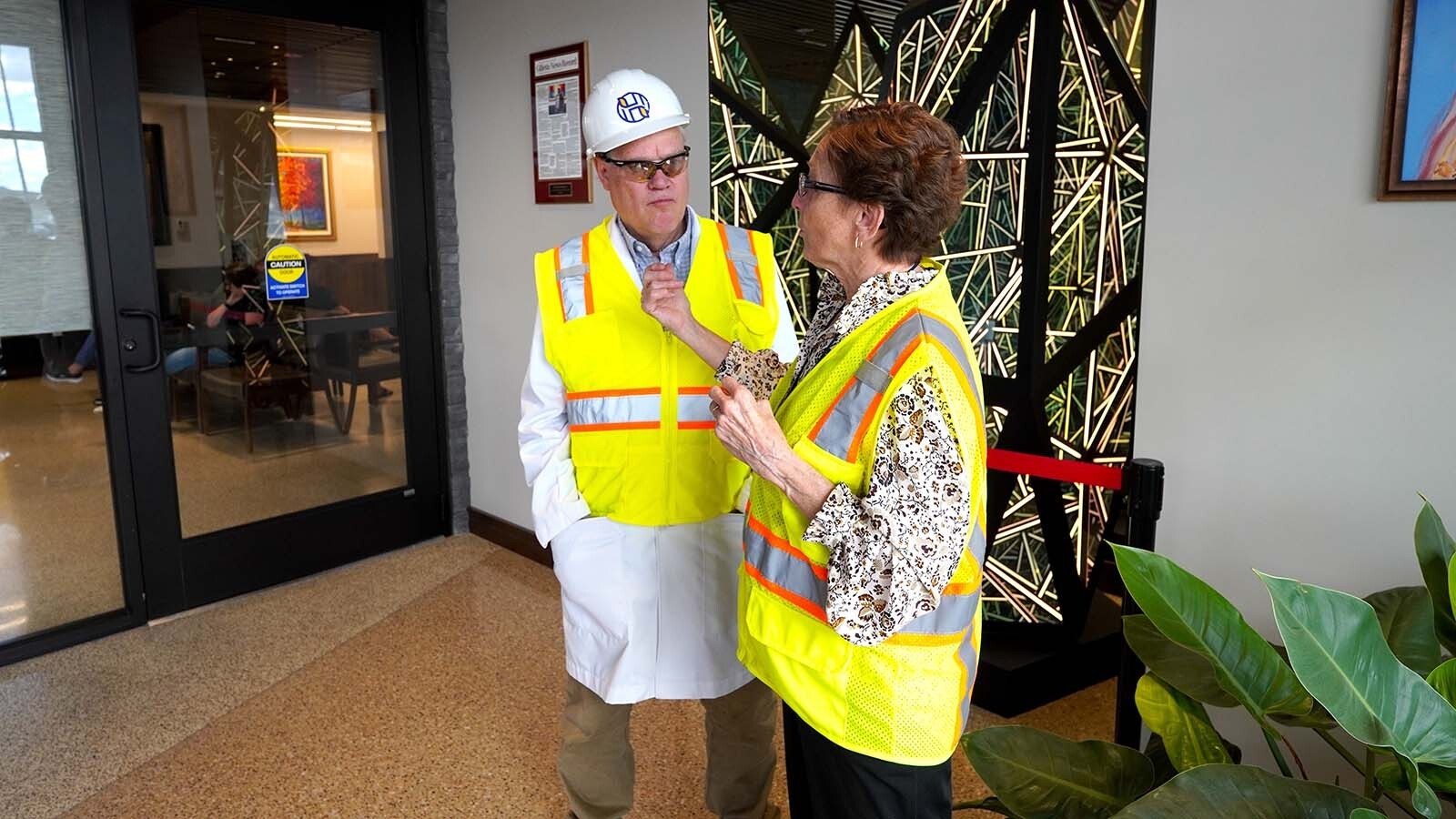 Patty and Mark Hoskinson in the lobby of the Hoskinson Health & Wellness Clinic in Gillette talk about the vision for an eventual 100,000-square-foot medical clinic they are planning, which is a legacy project for their son, Charles Hopkinson, cofounder of Ethereum and founder and CEO of Cardano.