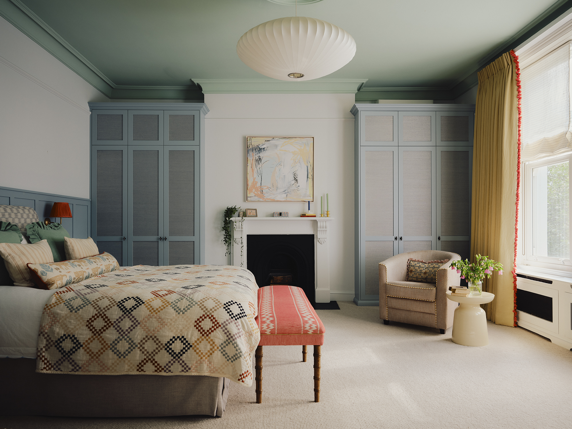A contemporary bedroom painted in multiple shades of mineral blue