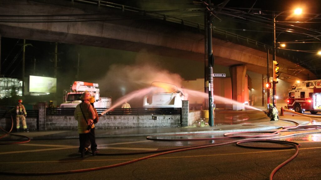 Firefights battle a boat fire