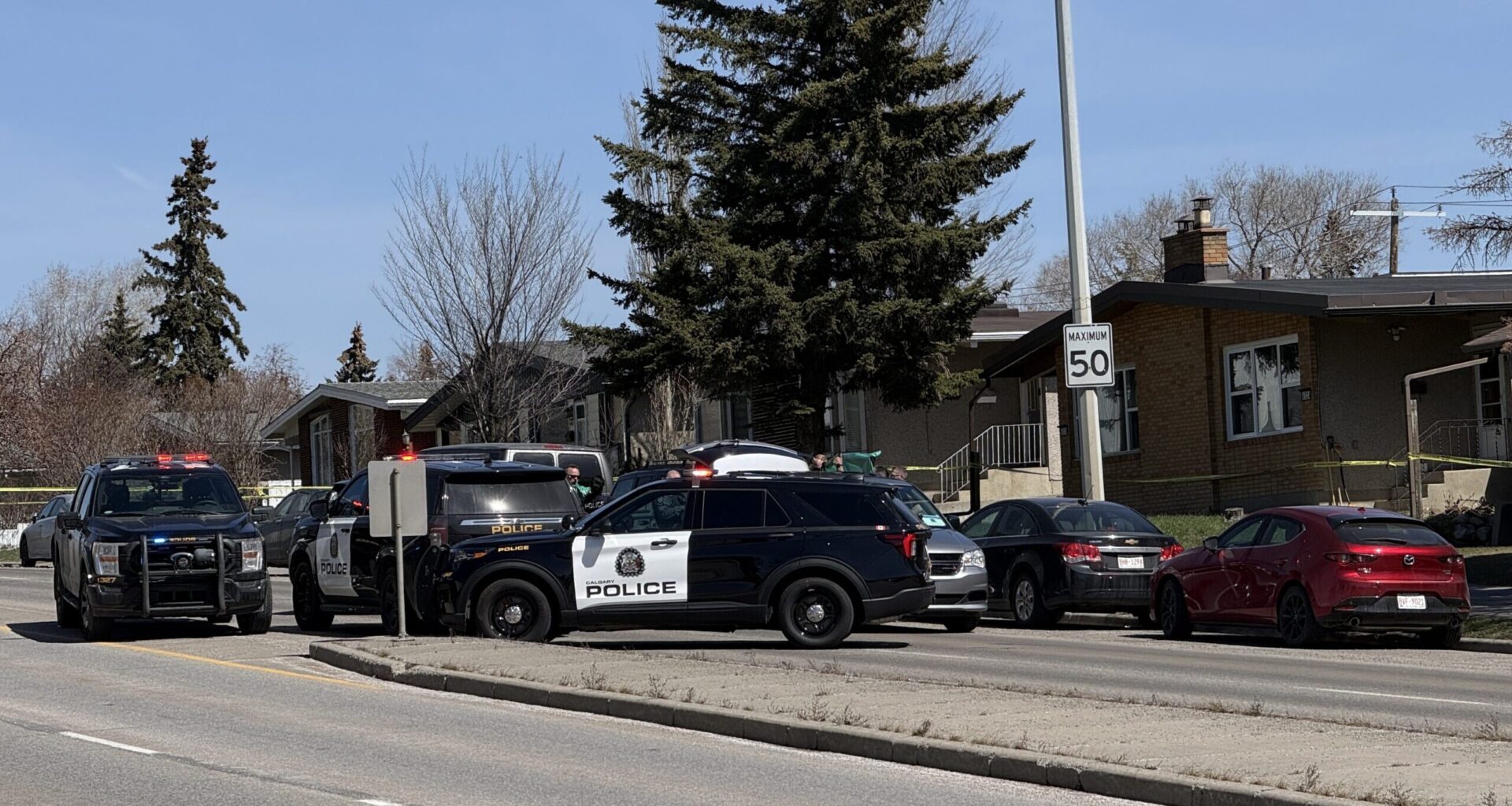 Two children found dead in car outside Calgary police station; man in custody