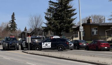 Two children found dead in car outside Calgary police station; man in custody