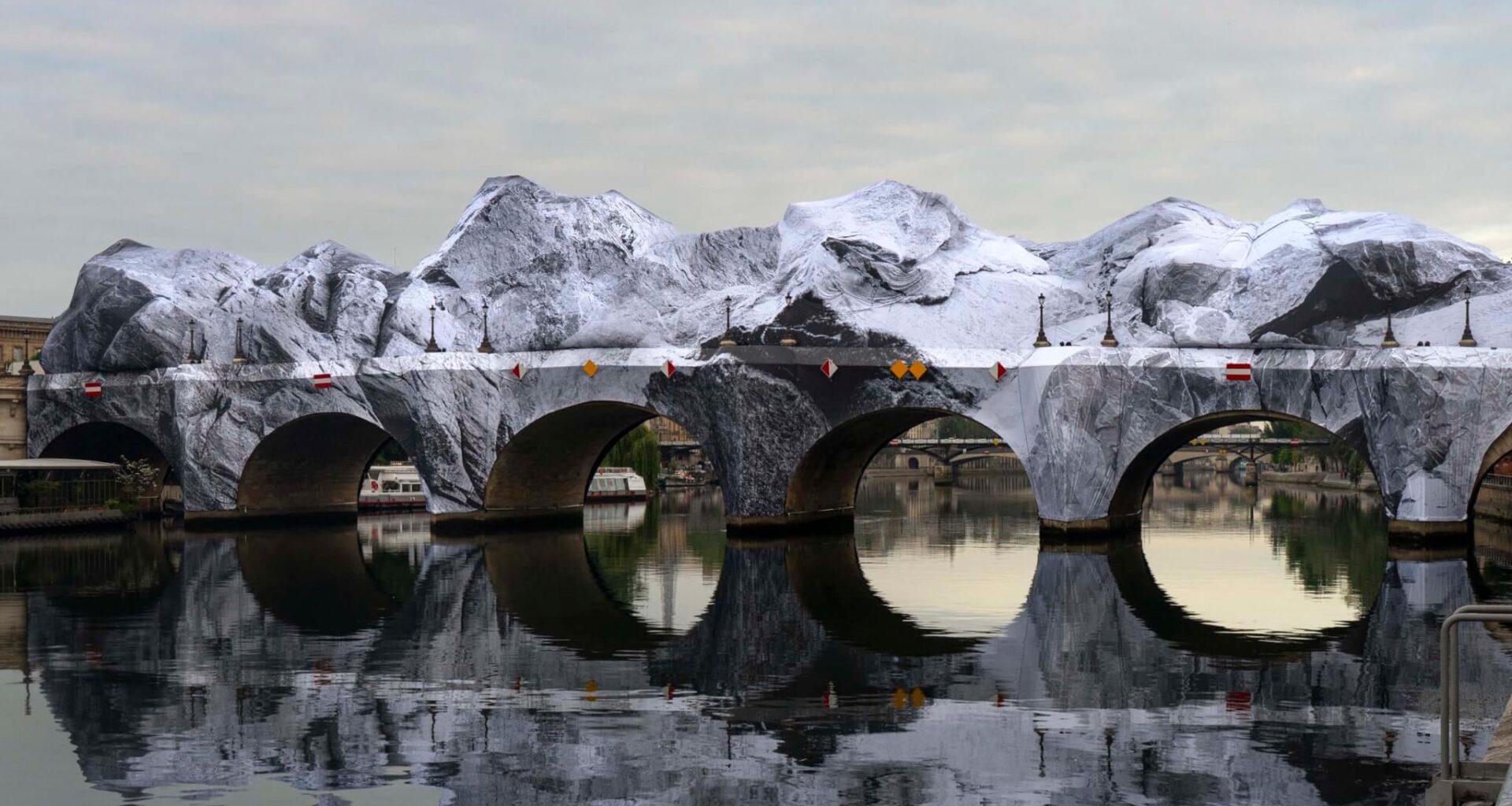 JR’s installation draping the Pont Neuf in Paris draws crowds