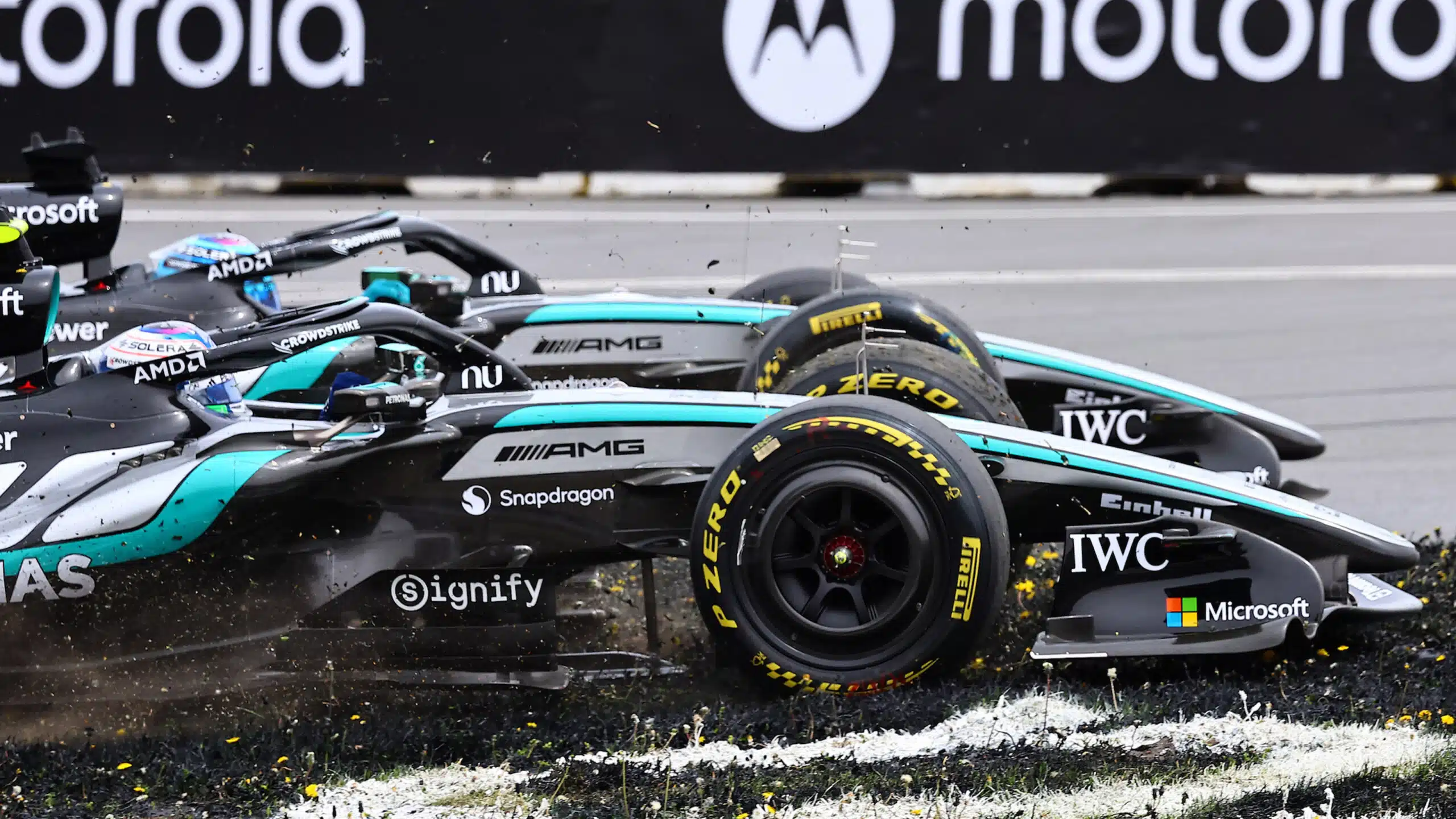 Kimi Antonelli side by side with George Russell as he runs off track at the 2026 F1 Canadian Grand Prix