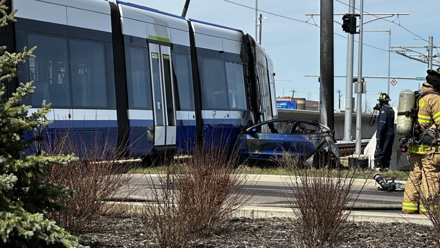Car catches fire after colliding with LRT on Whitemud overpass