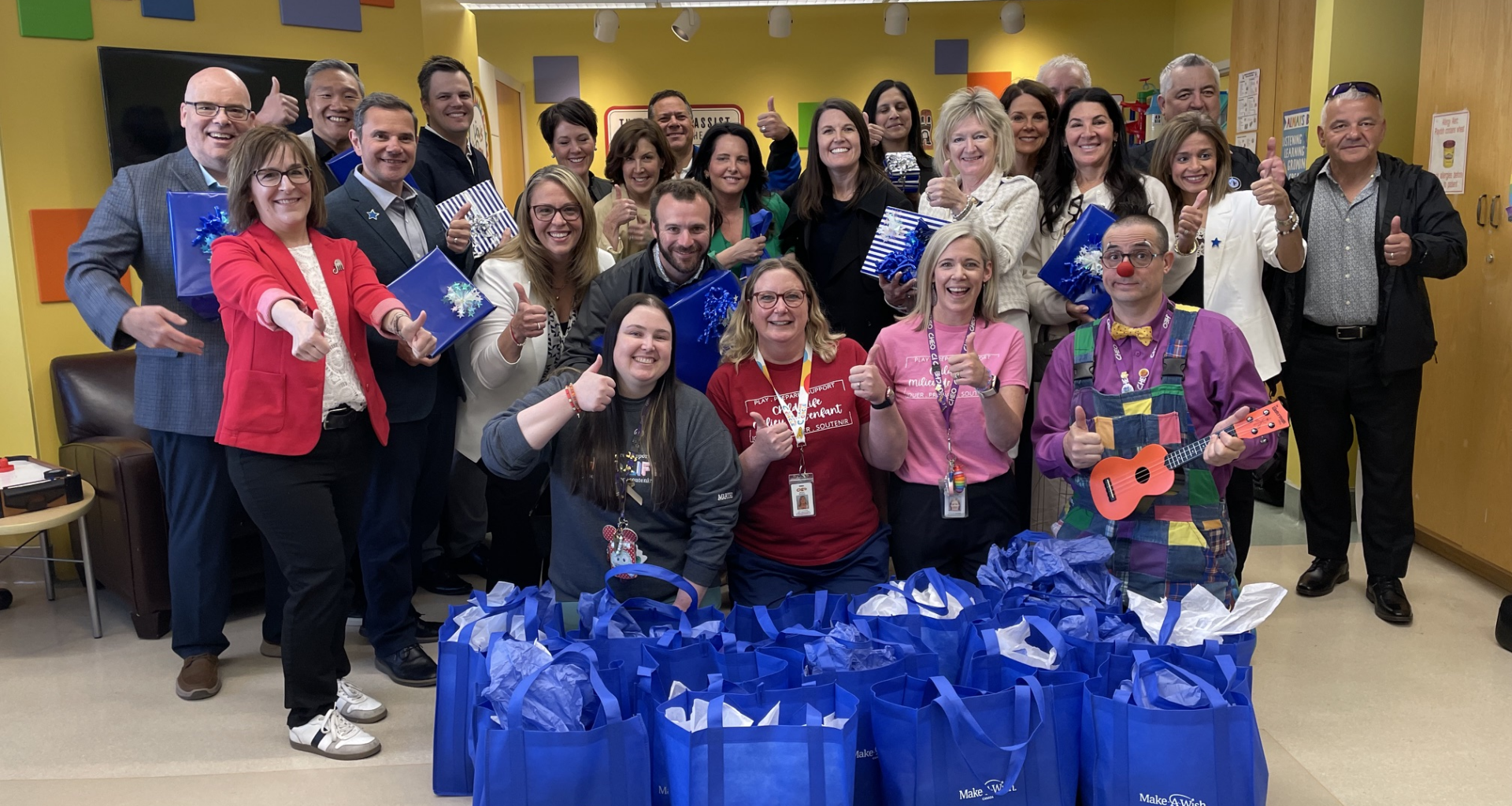 child life specialists pose with make-a-wish canada board of directors