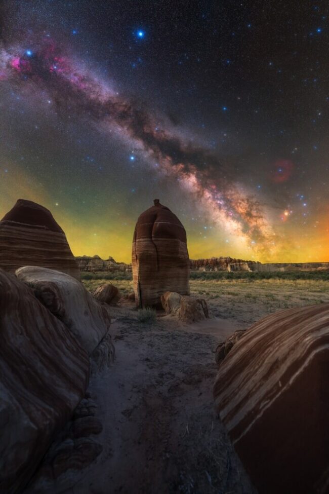 Rounded spires of rock with the Milky Way behind.