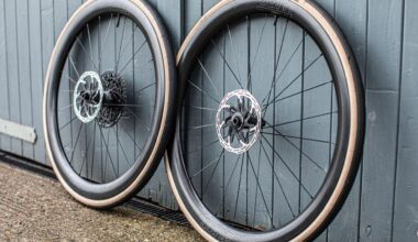 Tune Yokto 4550 wheels leaning against a wooden door painated blue