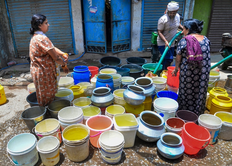 People collect water from a tanker amid a water shortage. (Photo: PTI)