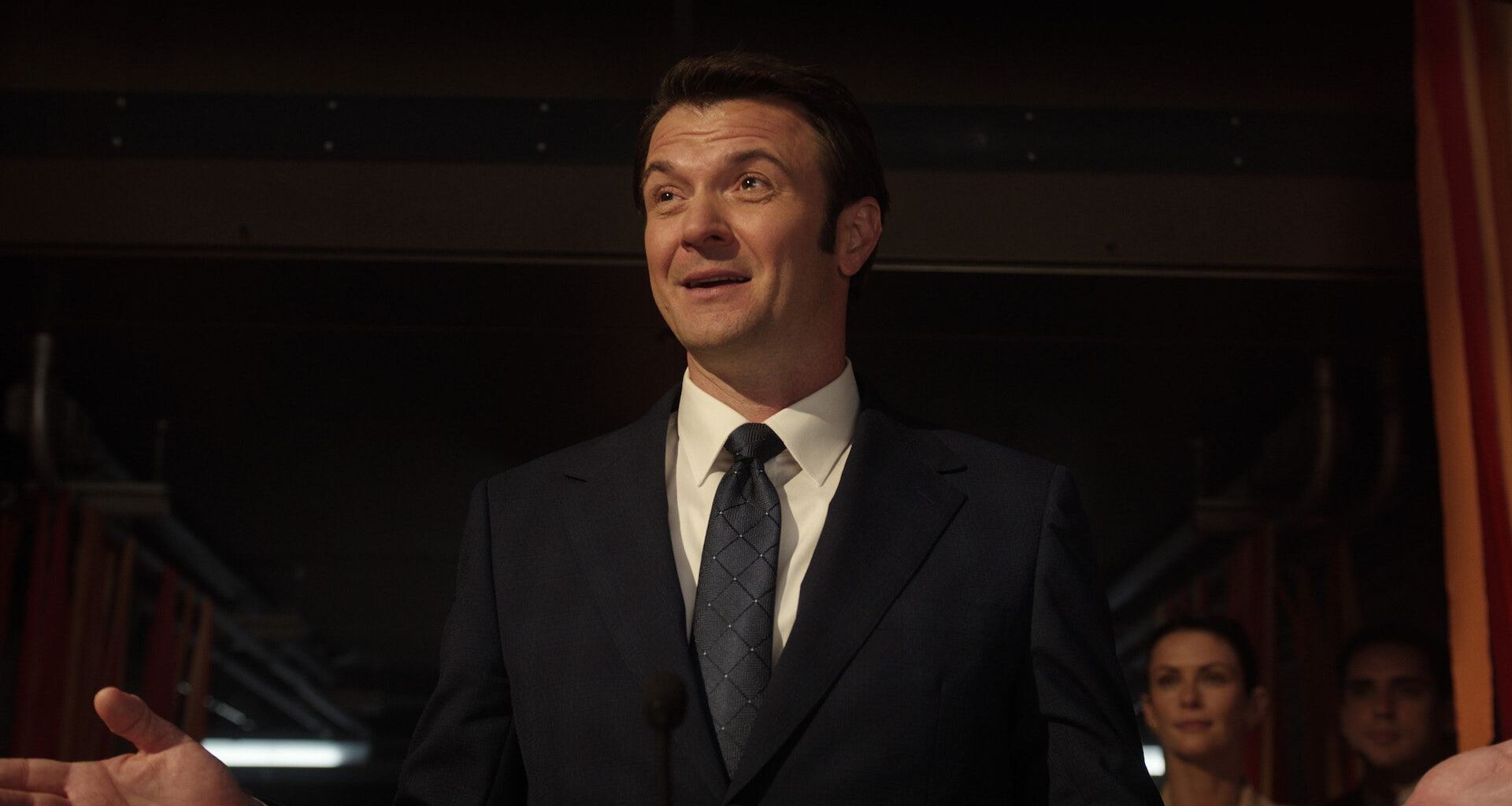a slick male politician in a 3-piece suit
