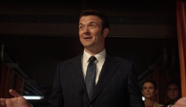 a slick male politician in a 3-piece suit