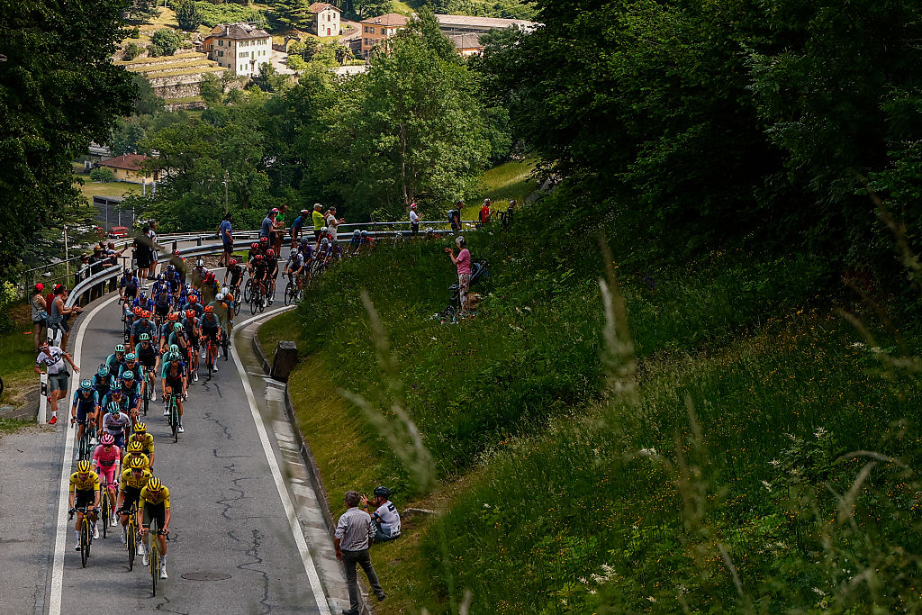 The pack rides during the 16th stage of the Giro d'Italia 2026 - Tour of Italy cycling race between Bellinzona and Cari, Switzerland, on May 26, 2026. (Photo by Luca Bettini / AFP)