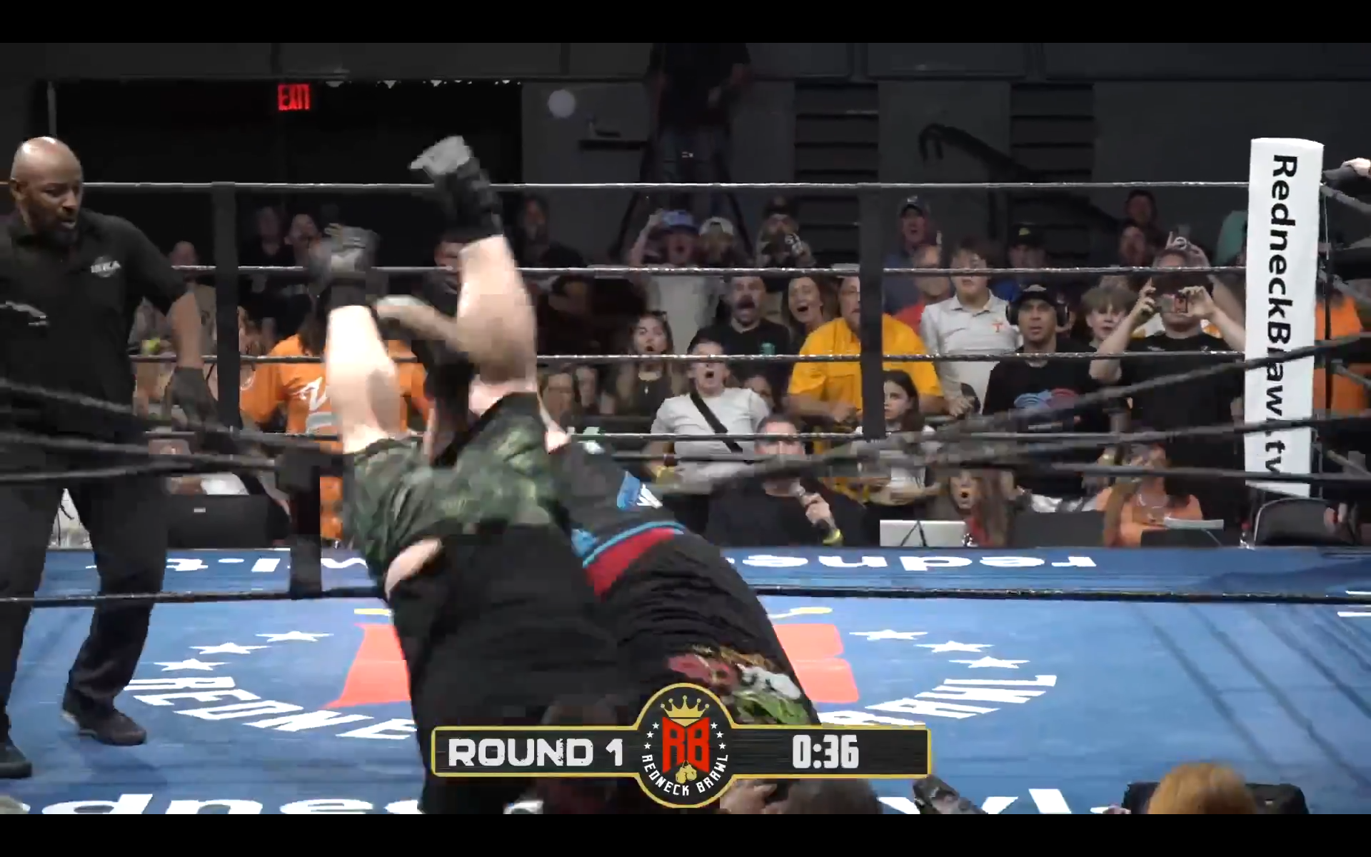 Sasquatch goes over the near side ropes with Big R…