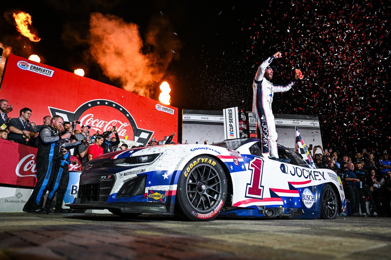 Trackhouse Racing No. 1 driver Ross Chastain celebrates with his team and Chevrolet Camaro ZL1 after winning the 2025 Coca-Cola 600 Ross Chastain in Victory Lane for Coca-Cola 600