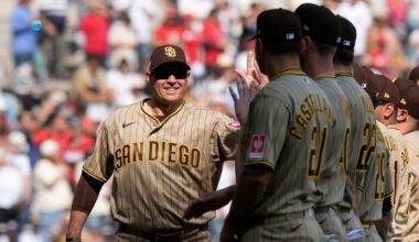 San Diego Padres' manager Craig Stammen, left, enters the field prior to a baseball game against Arizona Diamondbacks in Mexico City, Saturday, April 25, 2026. (AP Photo/Fernando Llano)