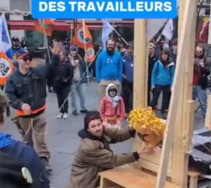 Police probe mock beheading of Quebec labour minister effigy at Montreal rally - Montreal