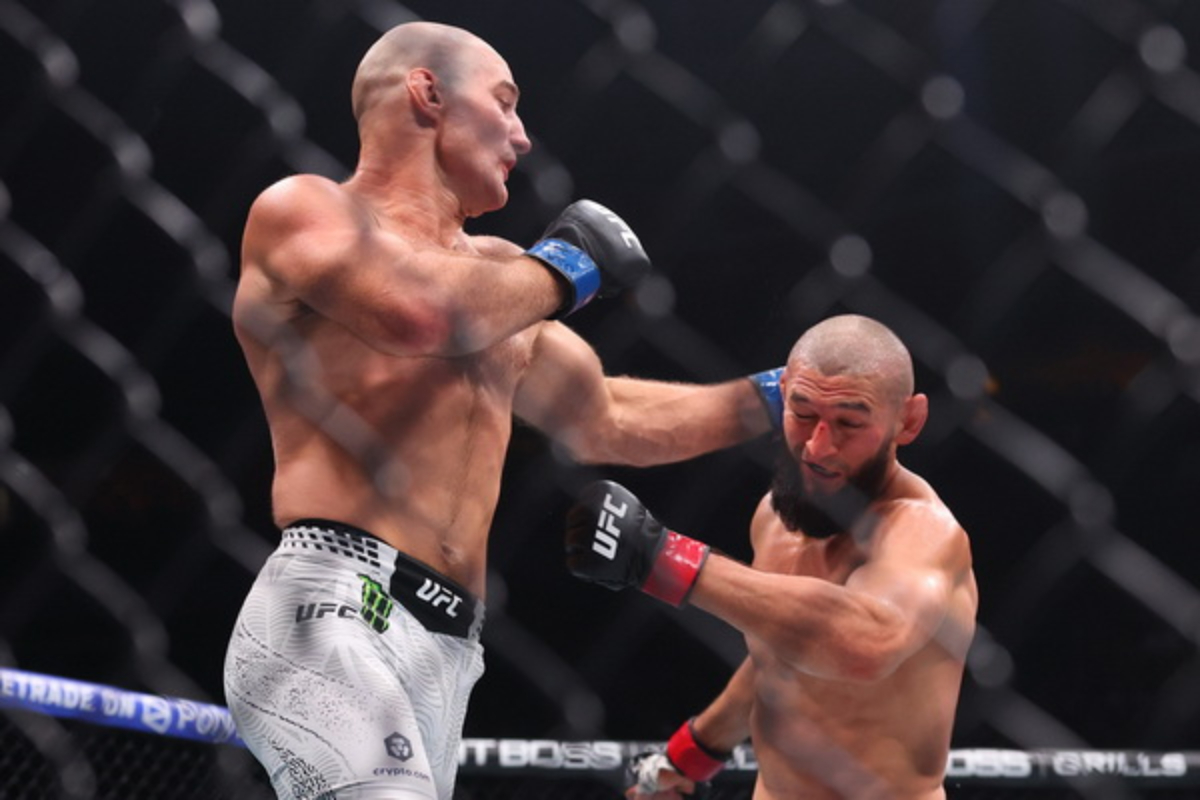 Sean Strickland lands a punch on Khamzat Chimaev at UFC 328
