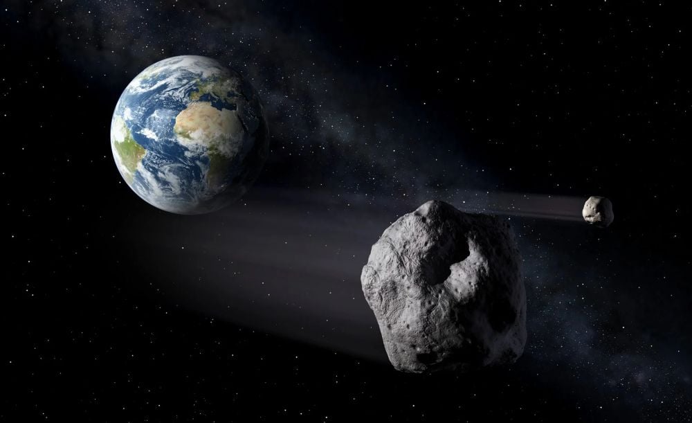 This artist's illustration shows a pair of asteroids passing by the modern-day Earth. New research shows that impact craters on the ancient Earth could have created "oxygen oases," where hydrothermal activity supercharged the growth of cyanobacteria and their stromatolite structures. It suggests that the Late Heavy Bombardment could have played a role in the oxygenation of Earth's atmosphere, paving the way for complex life. Image Credit: ESA/P.Carril