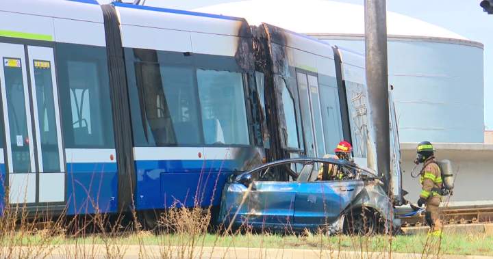 Fiery collision between Tesla and Valley Line LRT sends 1 to hospital, shuts down overpass - Edmonton