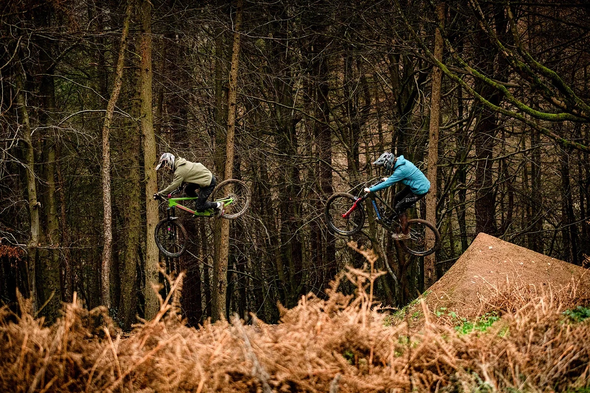 Two MTB'ers jumping at Farmer Johns MTB Park, Greater Manchester