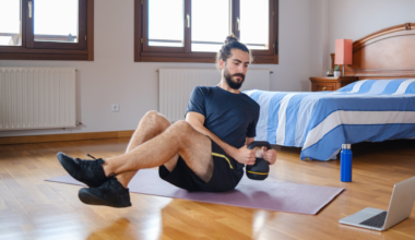 Man doing kettlebell Russian twist exercise