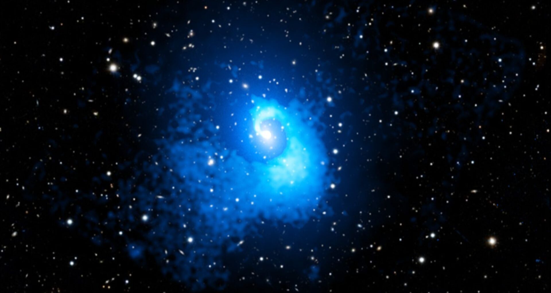 A blue spirally blob in the middle of a starry sky.