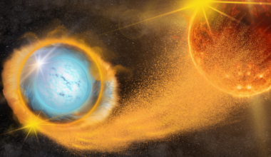 A blue-white orb has an orange ring around it. That ring is connected via dust to a reddish orange orb on the right.