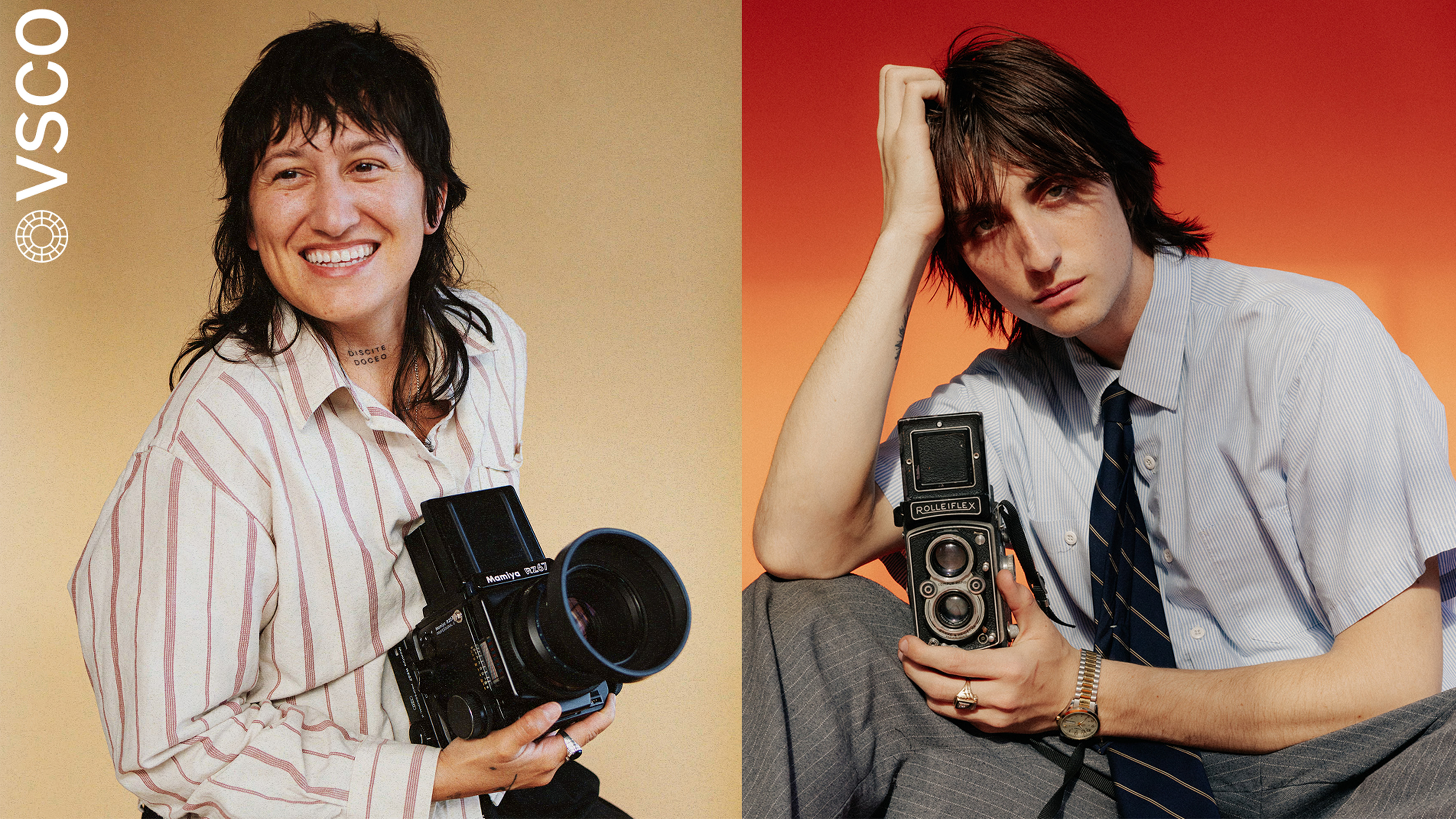 A woman and a man both holding cameras.